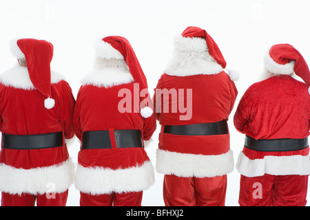 Un gruppo di uomini vestiti da Babbo Natale, vista posteriore Foto Stock