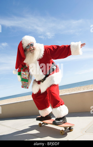 Babbo Natale skateboard Foto Stock