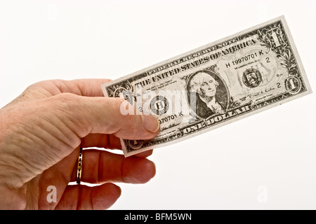 Mano che tiene una rappresentazione di un dollaro americano Bill Foto Stock