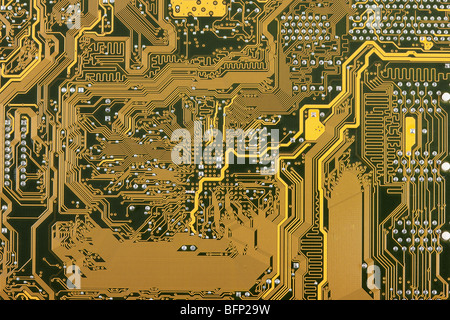 Golden industriale scheda di circuito elettronico di sfondo Foto Stock