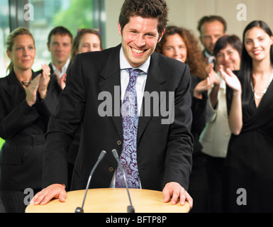 Business man dando una conferenza Foto Stock