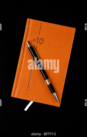 Il diario di marrone e penna Foto Stock