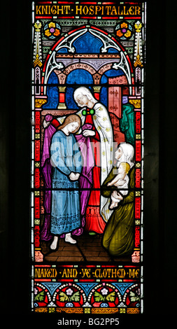 Dettaglio di una vetrata di Frederick Preedy raffigurante uno dei sei atti della Misericordia, Chiesa di Sant'Andrea, Tempio Grafton, Warwickshire Foto Stock