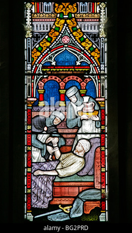 Dettaglio di una vetrata di Frederick Preedy raffigurante uno dei sei atti della Misericordia, Chiesa di Sant'Andrea, Tempio Grafton, Warwickshire Foto Stock