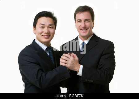 Imprenditore si stringono la mano e abbracciando Foto Stock