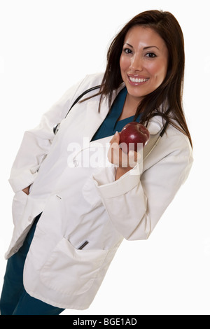 Giovani attraenti degli anni trenta amichevole donna ispanica medico azienda apple Foto Stock