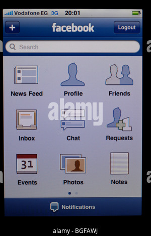 Schermo di Apple iPhone che mostra le applicazioni di Facebook sulla home page Foto Stock