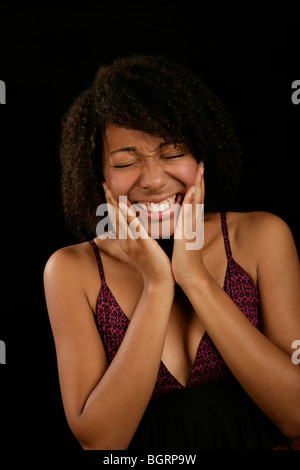 Giovane donna con il mal di denti Foto Stock