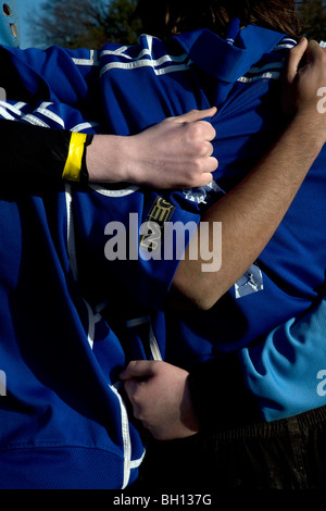 Ragazzi adolescenti di rugby huddle Foto Stock