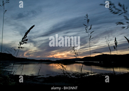 Tramonto a Scourie bay, Sutherland, Scozia. Foto Stock
