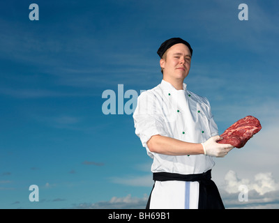 Lo Chef azienda carni fresche Foto Stock