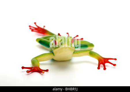 Frog giocattolo di plastica animale selvatico colorato zampe lunghe cat long tail predator bambini gioco fingere icona grafica iconica Foto Stock