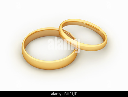 2 anelli d oro, simbolo per il matrimonio / fusion - 2 goldene Ringe, simbolo für fusione / Heirat Foto Stock