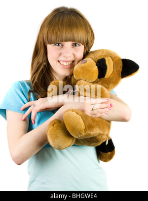 Bella bionda adolescente tenendo un orsacchiotto Foto Stock