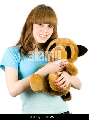 Bella bionda adolescente tenendo un orsacchiotto Foto Stock