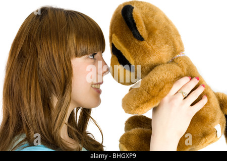 Bella bionda adolescente tenendo un orsacchiotto Foto Stock