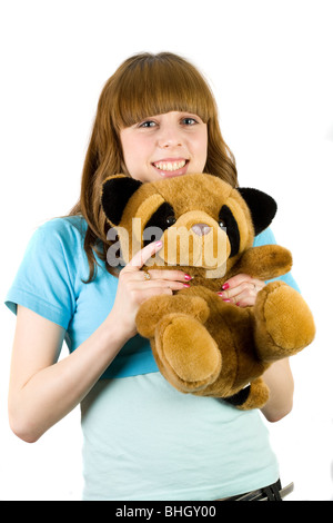 Bella bionda adolescente tenendo un orsacchiotto Foto Stock