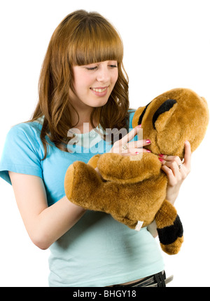 Bella bionda adolescente tenendo un orsacchiotto Foto Stock