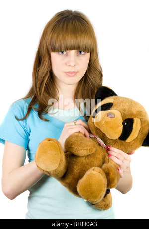 Bella bionda adolescente tenendo un orsacchiotto Foto Stock