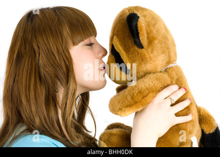 Bella bionda adolescente tenendo un orsacchiotto Foto Stock