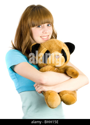 Bella bionda adolescente tenendo un orsacchiotto Foto Stock