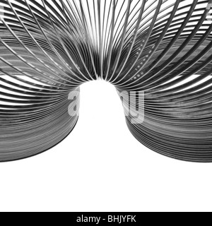 Slinky chrome su sfondo bianco Foto Stock