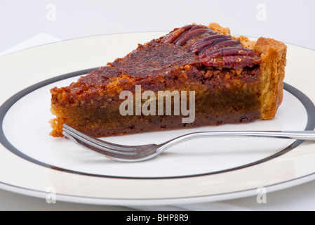 Fetta di torta alle noci pecan Foto Stock