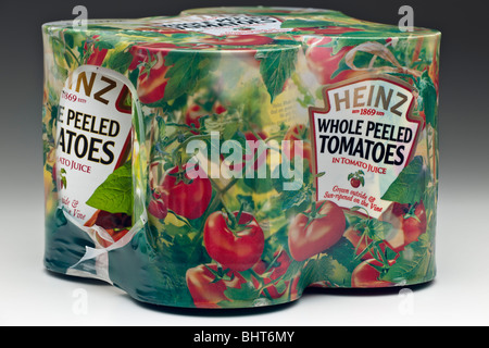 Quattro lattine di materiale plastico retraibile cellophane avvolto Heinz pomodori pelati interi Foto Stock