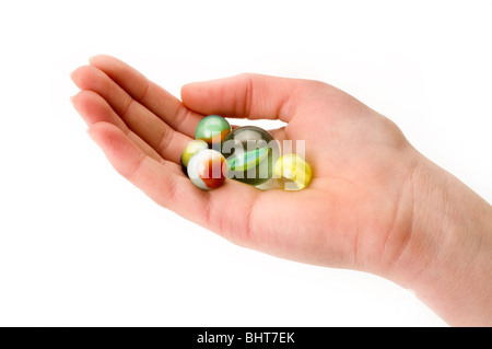 Mano sul bianco con marmi Foto Stock