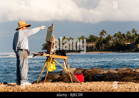 "Plein Air' artista pittura al Porto di Lahaina Hawaii Maui. Molokai in background Foto Stock