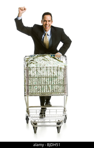 Commercianti con un carrello pieno di denaro Foto Stock