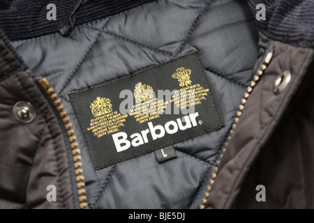 Un'etichetta in una Barbour coat. Foto Stock