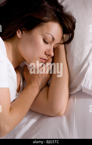 La donna a letto Foto Stock