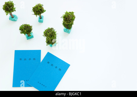 Modello di alberi e libretti di pensione Foto Stock
