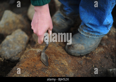 Il Roundhouse archeologico sito a Bellever, Dartmoor che è indagata dal Parco Nazionale di Dartmoor Foto Stock