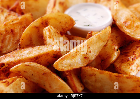 Spicchi di patate con un tuffo cibo foto Foto Stock