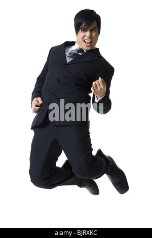 Businessman jumping Foto Stock