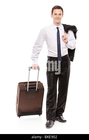 Happy business traveler trasportare il suo bagaglio Foto Stock