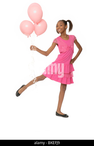 Dieci anni di ragazza con palloncini. Foto Stock