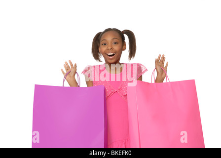 Dieci anni di ragazza con borse per lo shopping. Foto Stock