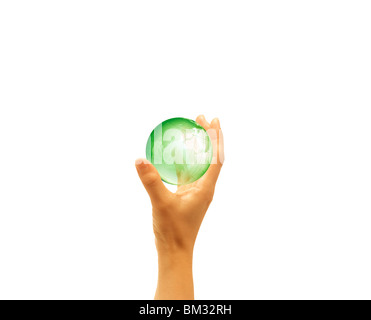 Mano che tiene la messa a terra Foto Stock