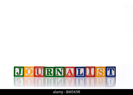 Bambini colorati blocchi del giornalista per il controllo ortografico Foto Stock