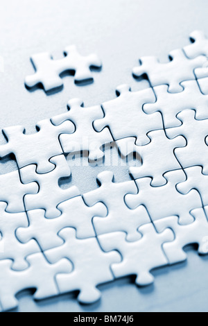 Puzzle assemblato con un pezzo mancante Foto Stock