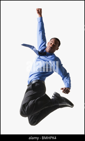 Businessman jumping Foto Stock