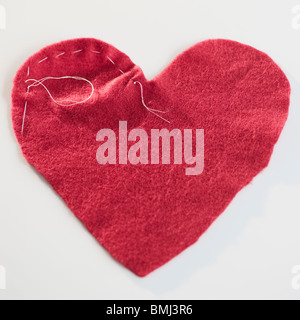 Cucito cuore rosso Foto Stock
