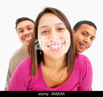 Tre persone sorridenti Foto Stock