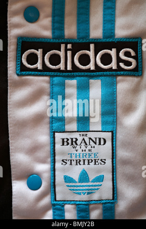 the brand with the 3 stripes tuta