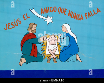 Un murale colorato la lettura di "Gesù, l'amico che mai fallisce' sulla parete di una scuola a Mancora nel nord del Perù Foto Stock