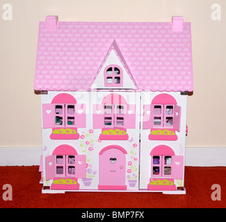 Una rosa e bianco Dolls house. Foto Stock