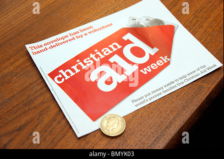 £ 1 gettone donazione con carità busta di raccolta per Christian Aid settimana Foto Stock